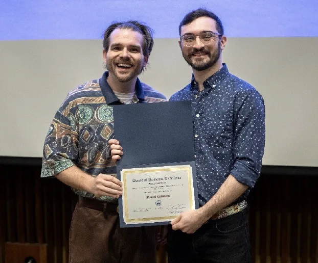 Tyler Baker presenting Daniel Cabaniss with award.