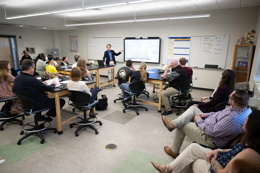 Dylan Sullivan presenting in front of a class during a workshop.