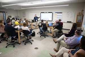 Dylan Sullivan presenting in front of a class during a workshop.