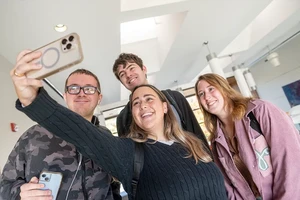 A group of smiling Landmark Students taking a selfie.