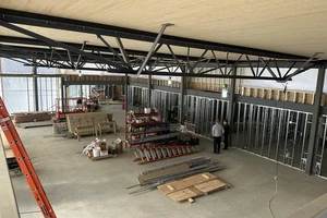 Overhead view of interior showing concrete floors and steel framework