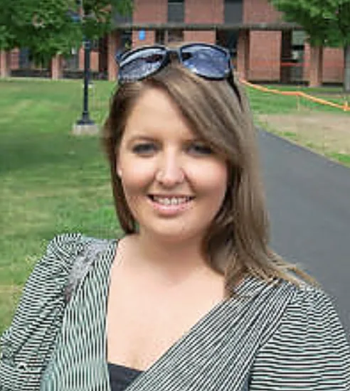 Headshot of Meghan Benzel on Landmark College quad.