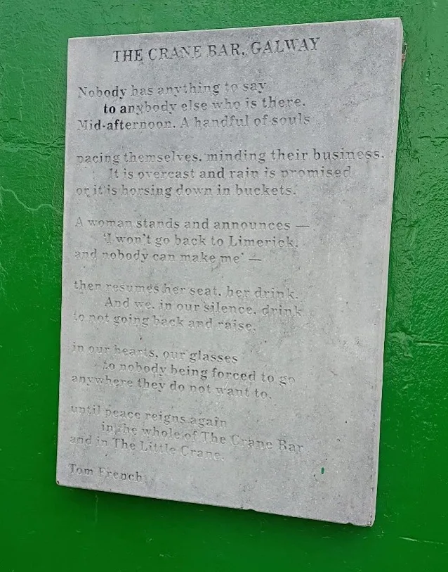 A poem about the Crane Bar by Tom French carved onto a letter sized marble slab