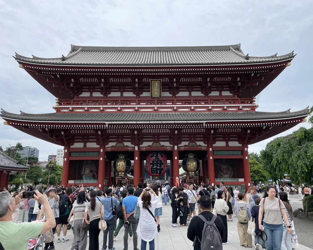 Large crowd of people outside temple building