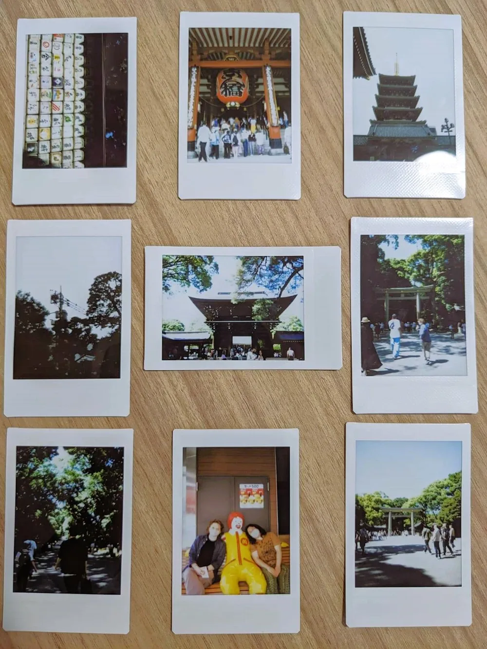 An array of printed photos displayed on a table