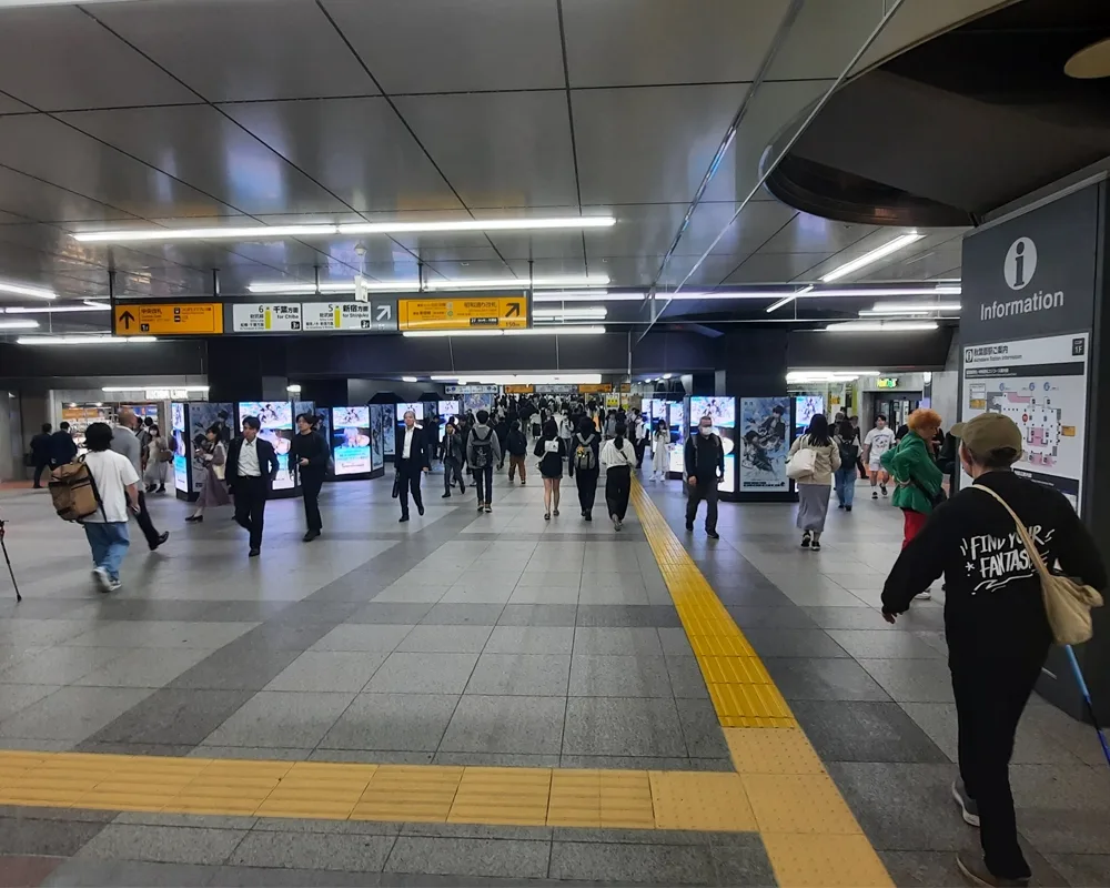 People walking in a crowded subway station in Japan. 