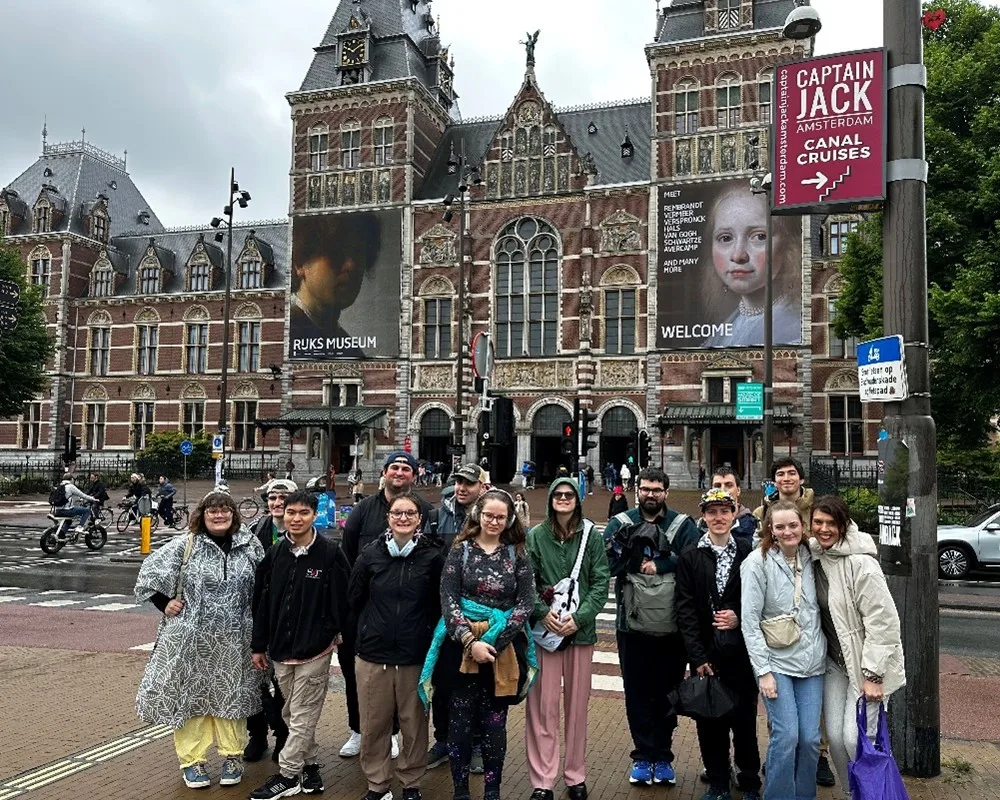 Group of students and leaders in front of Amsterdam's Rijksmuseum