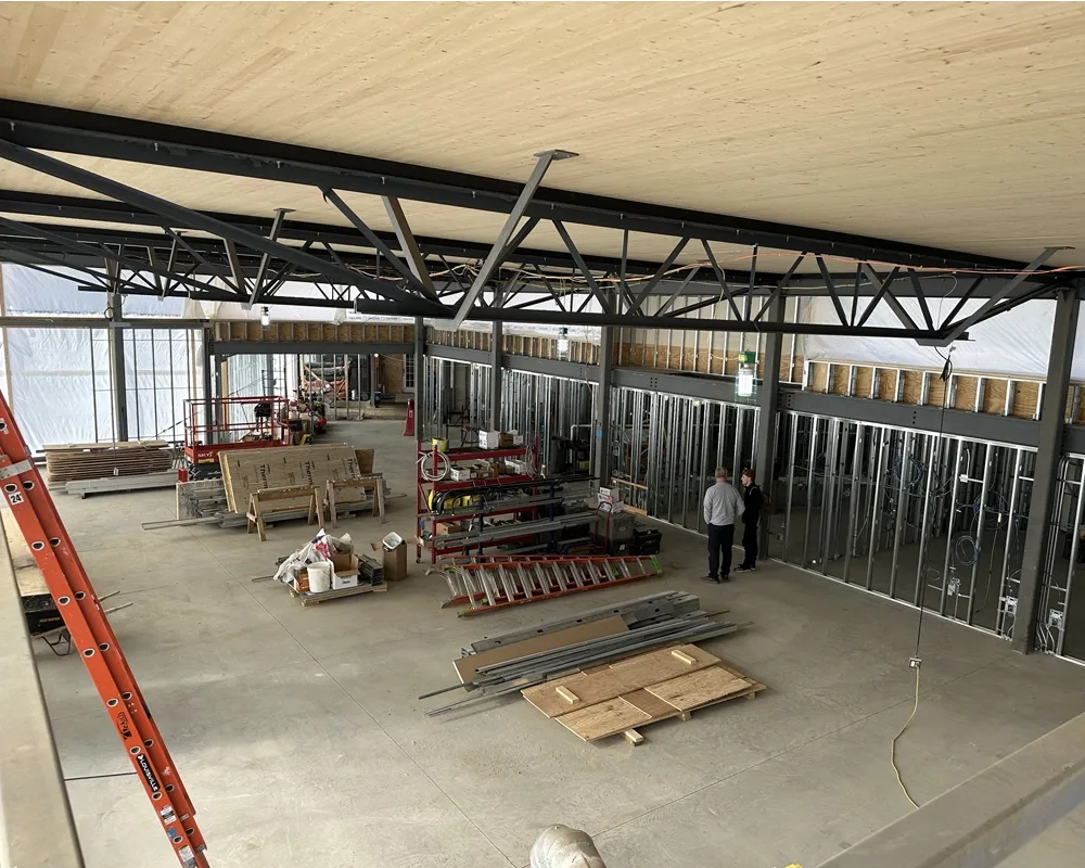Overhead view of interior showing concrete floors and steel framework