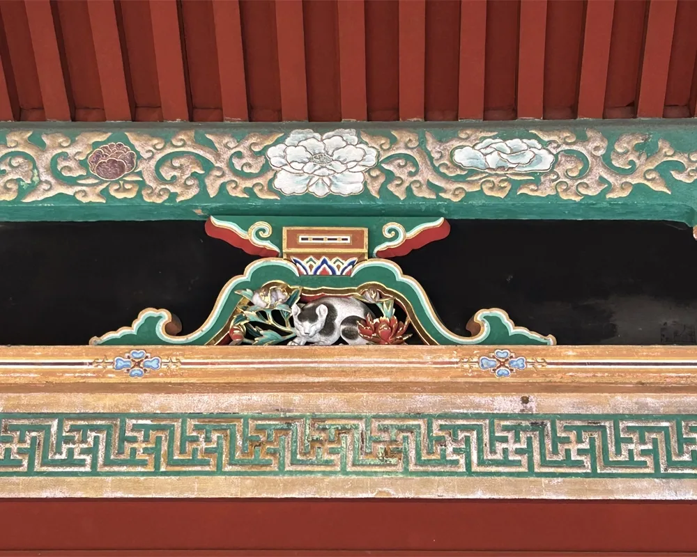 intricate carving of a sleeping cat