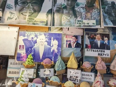 Storefront with imitation ice cream cones and old photos of Barack Obama.