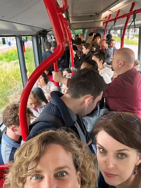 a selfie photo of a very full busload of people.