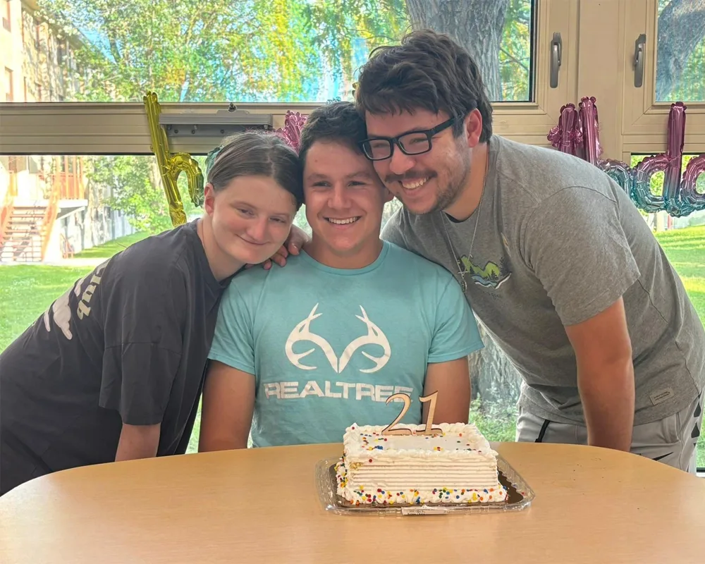 Students with a birthday cake "