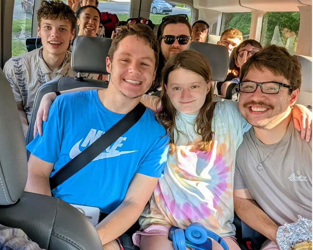 Landin Students sitting in a van
