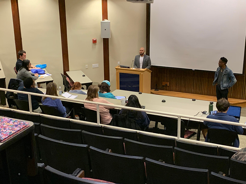 Audience point of view image of Steffen Gillom at podium and Marc Thurman at center stage as they field audience questions.