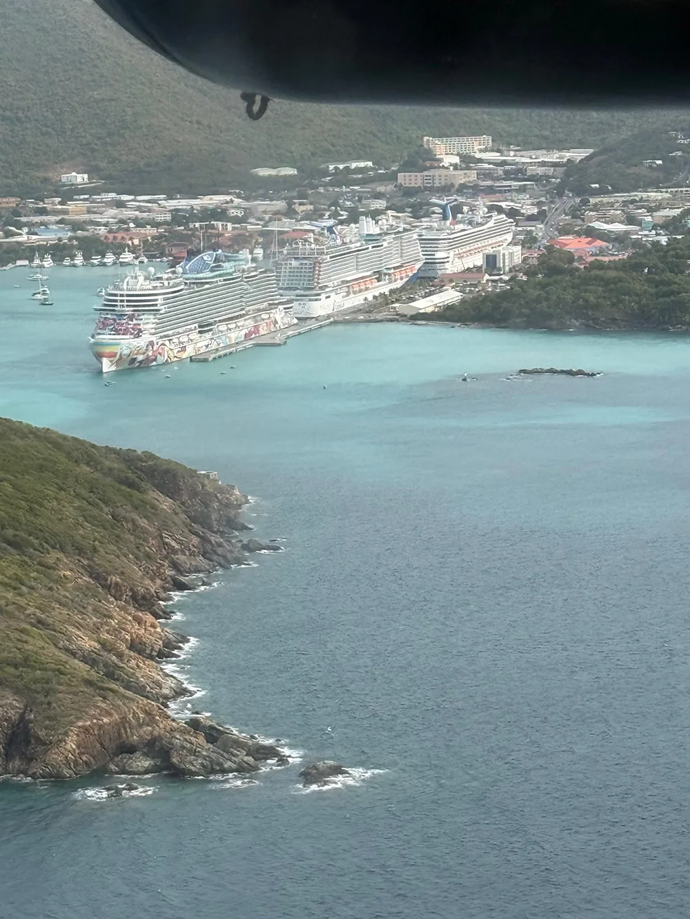 aerial view of harbor with large cruise ships docked