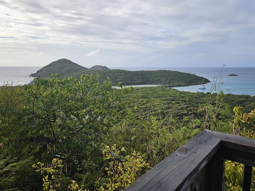 view of sea and a large island from a balcony