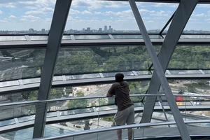one person looking out at a view of Berlin