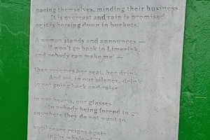 A poem about the Crane Bar by Tom French carved onto a letter sized marble slab