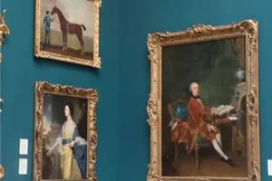 3 portraits in ornate guilded frames, the first of an 18th century woman, the second of a man and his horse and the third of an 18th century man, sitting at a desk in front of an open book