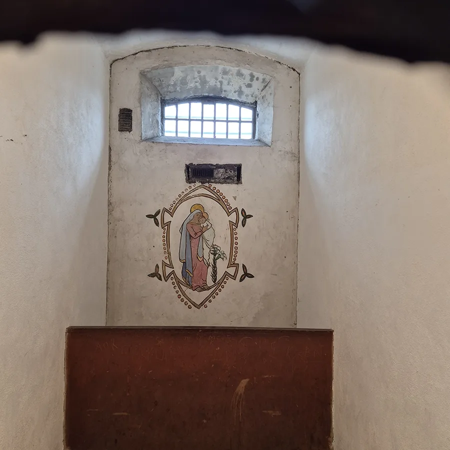 A painting that Grace Plunkett made while incarcerated on the wall.