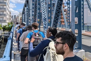 Landmark students cross the Onagi River on their way to class.
