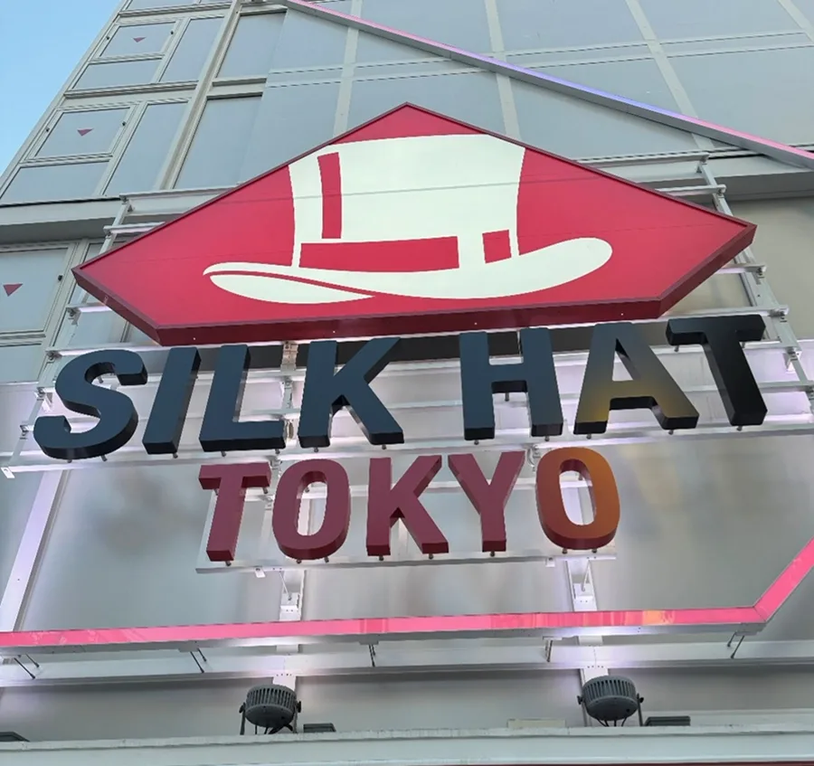 A large sign reading SILK HAT TOKYO.