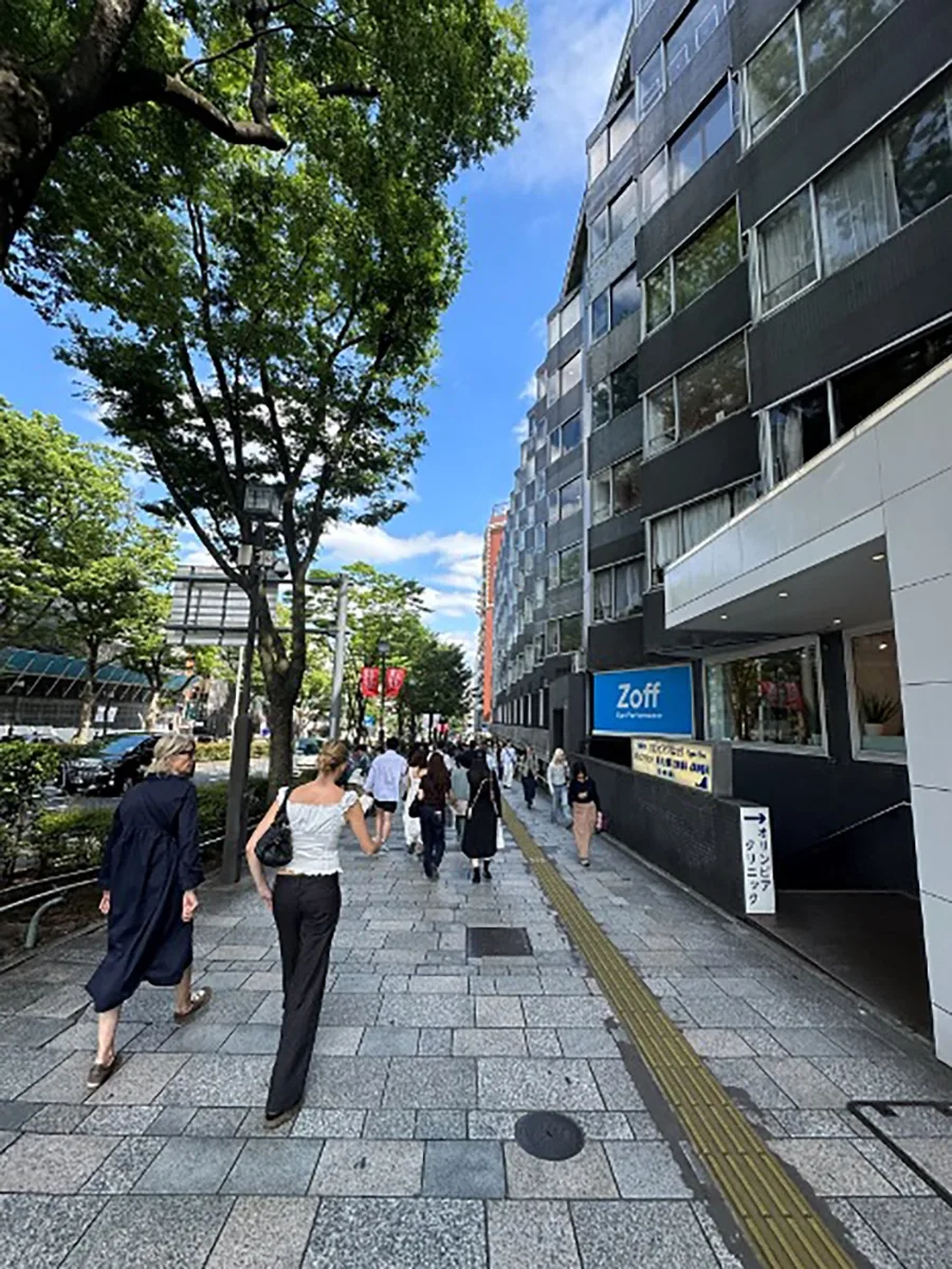 People walking on an urban street in Tokyo.
