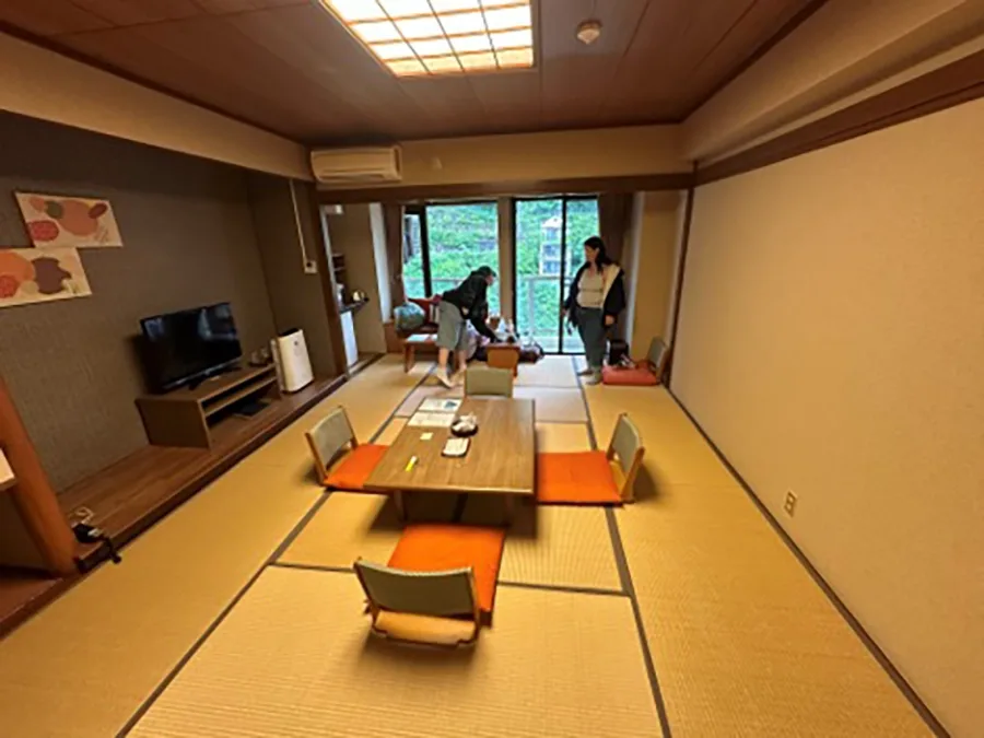 Students in a hotel room in the traditional Japanese style.