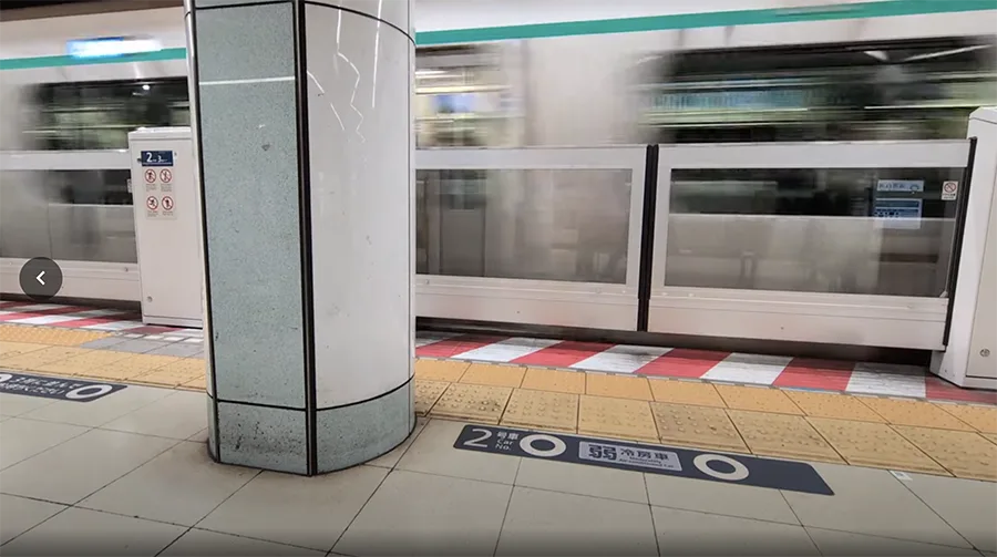 A fast moving subway train appears as a blur as it arrives in the station.
