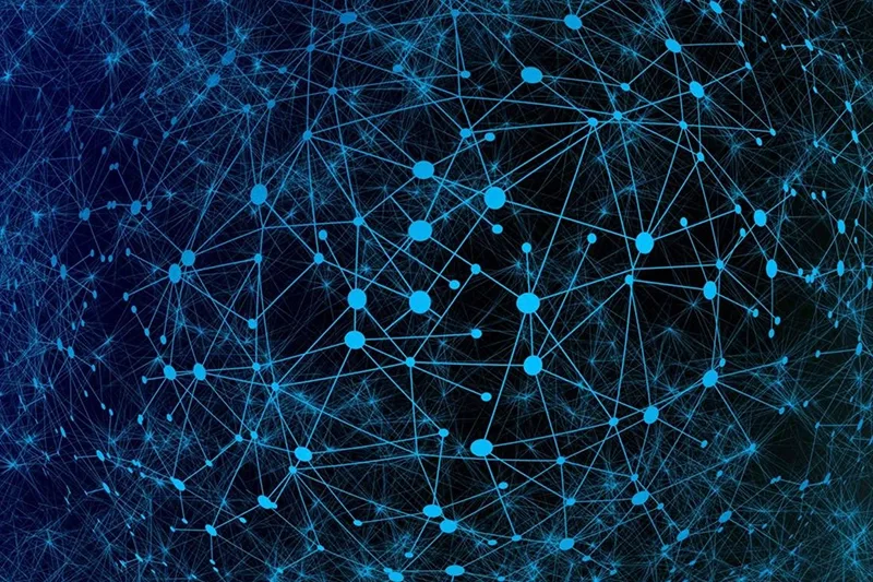 A dark network of connected blue dots on a black background.