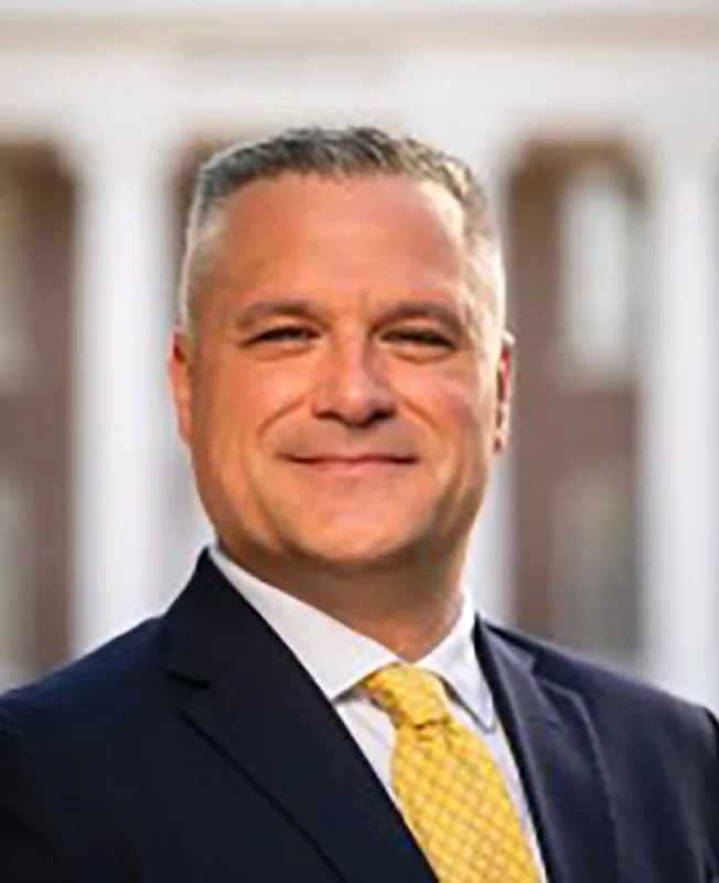 Headshot of Dan Buryj.