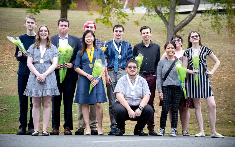 Honor society students pose for a photo.