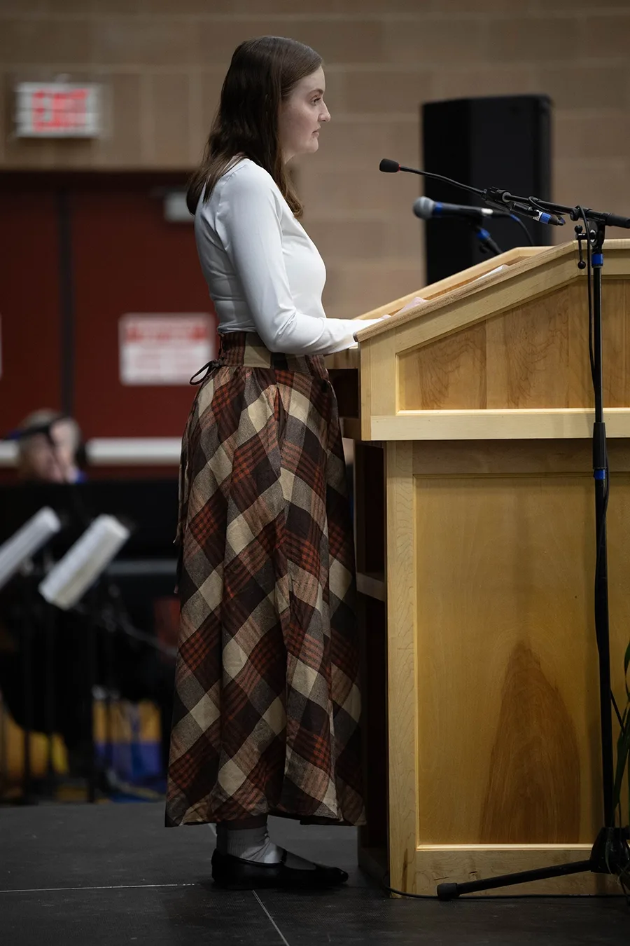 A person standing at a podium giving a speech.