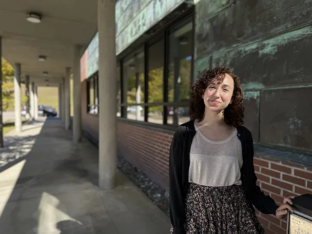 Gabrielle Ewall standing outside of the STEM building on campus.