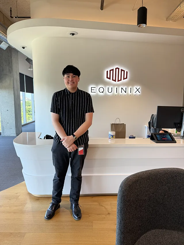 LC Student Jaden Clark stands in an Equinix office in Frisco, Texas.