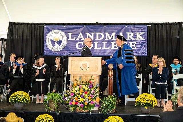 US Senator Peter Welch shakes hands with Landmark College President Jim Dlugos during the Convocation and Inauguration ceremony.