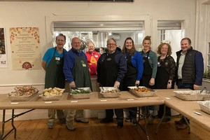 Members of the Landmark College leadership team pose for a picture while handing out food at the Putney Community Supper on Friday, November 14.