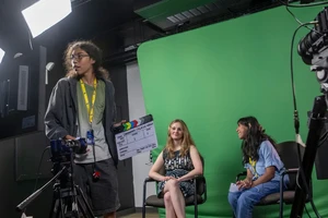 Landmark College students working with television production equipment in the student media lab.