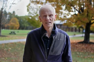 Jim Baucom standing on the Landmark College quad in autumn.