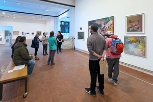 A group of students touring the Brattleboro Museum and Art Center gallery.