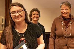 Student Sarah Silvestro with faculty members Susan Frishberg and Norma Willingham during 2018 Academic Awards ceremony.
