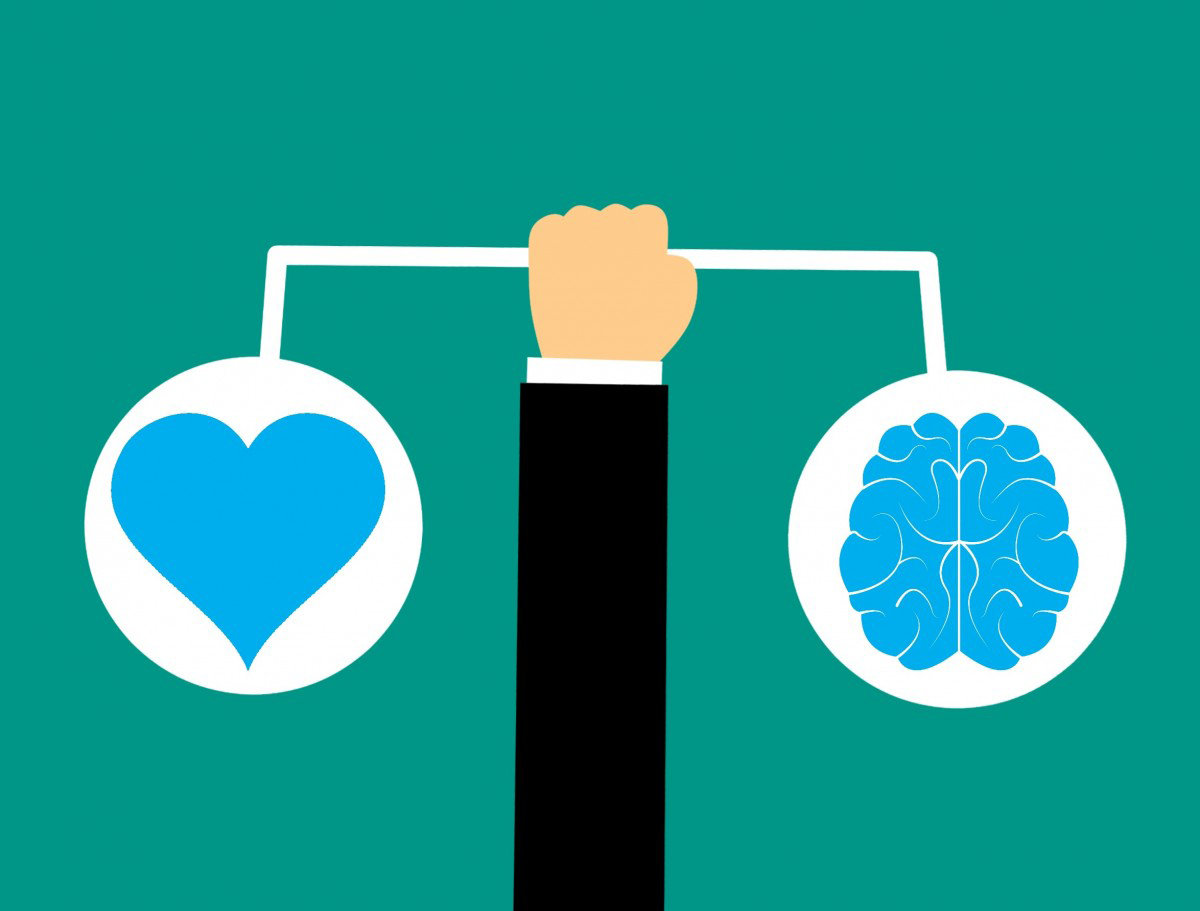 Drawing of an arm holding up a scale with a heart on one side and a brain on the other.