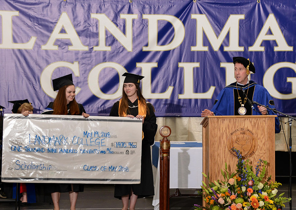 Students present President Eden with Class Gift, a check in the amount of $1,970.18.
