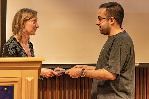 Coplan handing Agudelo his award.