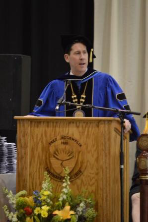 Dr. Eden standing at the podium.