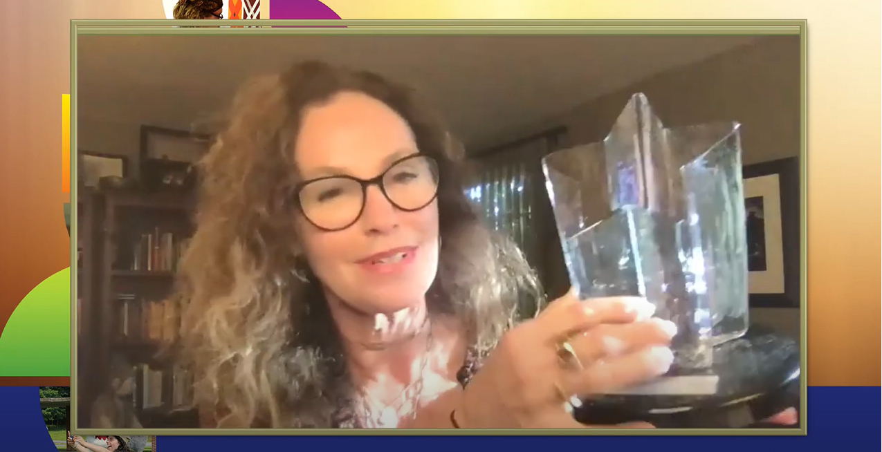 Screen capture of Amy Brenneman holding up the LD Luminary Award.