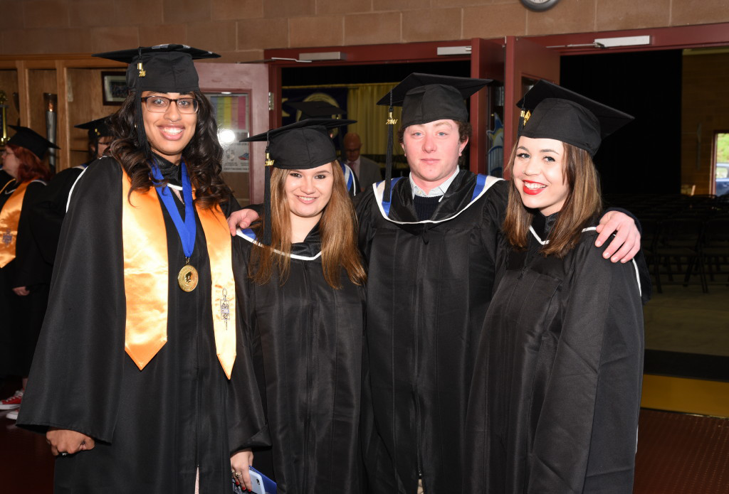 Graduates pose in Click Family Sports Center.