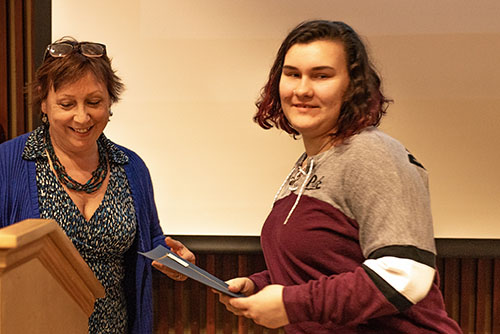 Hinckley handing Bacastow her award.