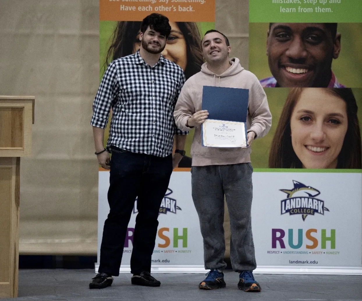 Dominic Limaldi holding his award with Angel Cintron to the left.
