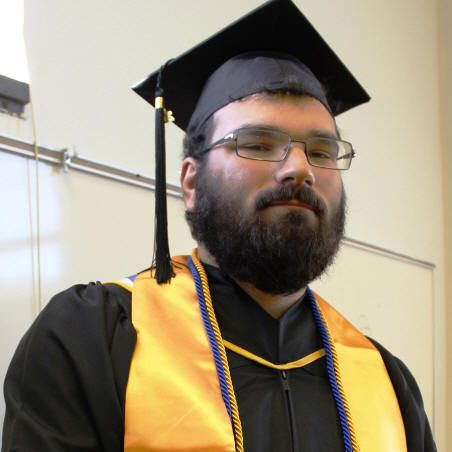Matthew Bavelock in cap and gown.